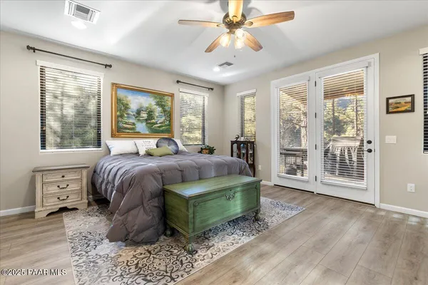 a living room with a couch and a wooden floor