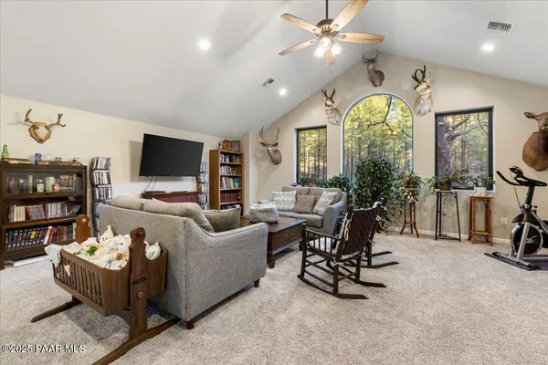 a bed room with a bed and a chandelier