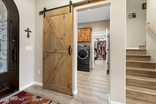 a outdoor dining space with furniture and wooden floor