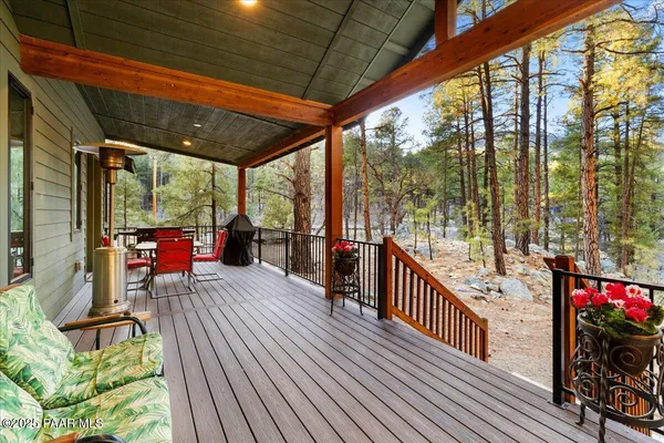 a outdoor dining space with furniture and outdoor view