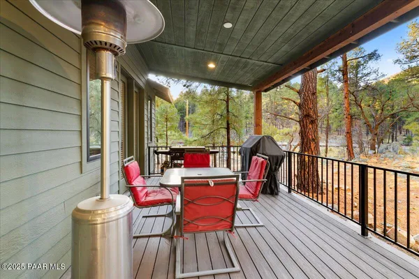 a view of a backyard with large trees