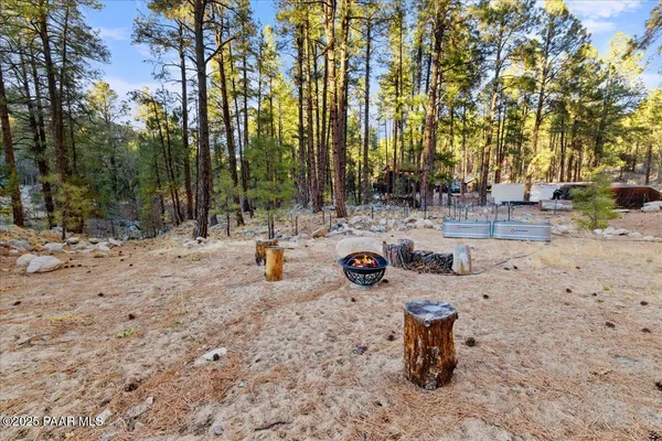 a view of a yard with a tree