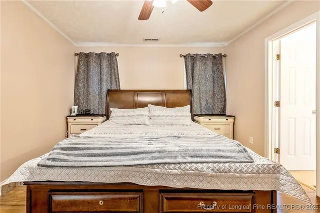 a bedroom with a bed and a dresser