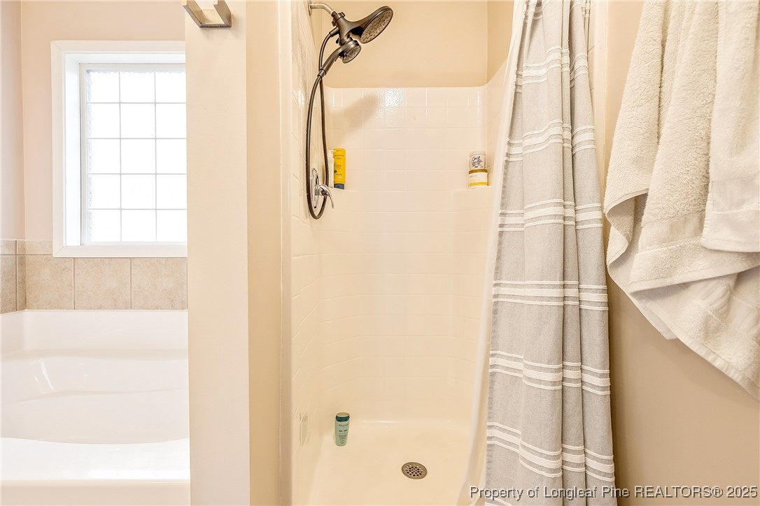191 Quarry Lane Raeford, NC 28376 - Photo 19 of 28 a bathroom with a shower