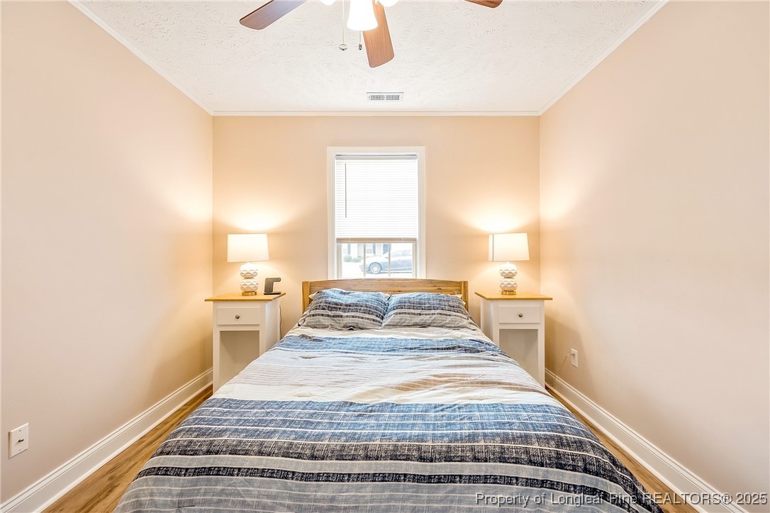 191 Quarry Lane Raeford, NC 28376 - Photo 27 of 28 a bedroom with a bed and a window