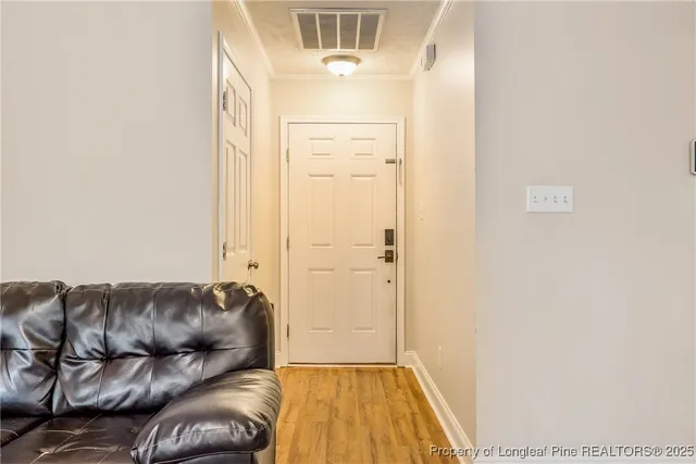 a living room with a couch and a dresser