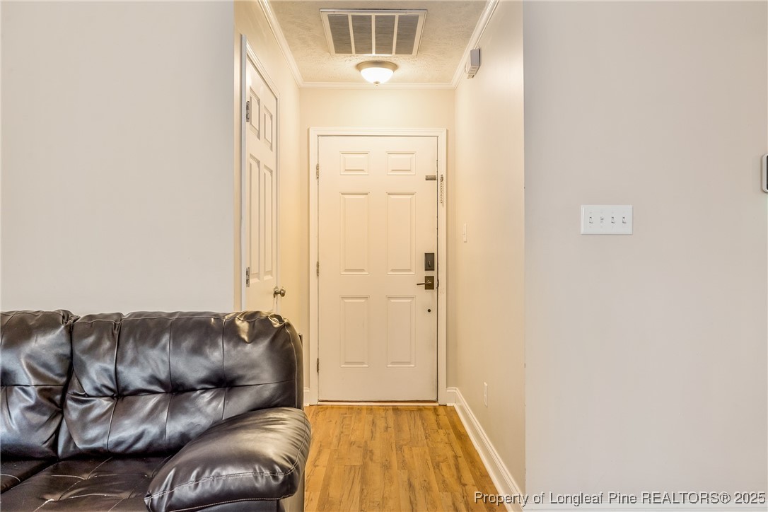 191 Quarry Lane Raeford, NC 28376 - Photo 28 of 28 a living room with a couch and a dresser