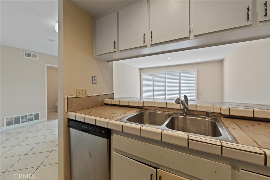 1381 South Walnut Street, Unit 2008 Anaheim, CA 92802 - Photo 12 of 40 a kitchen that has a sink and a granite counter tops