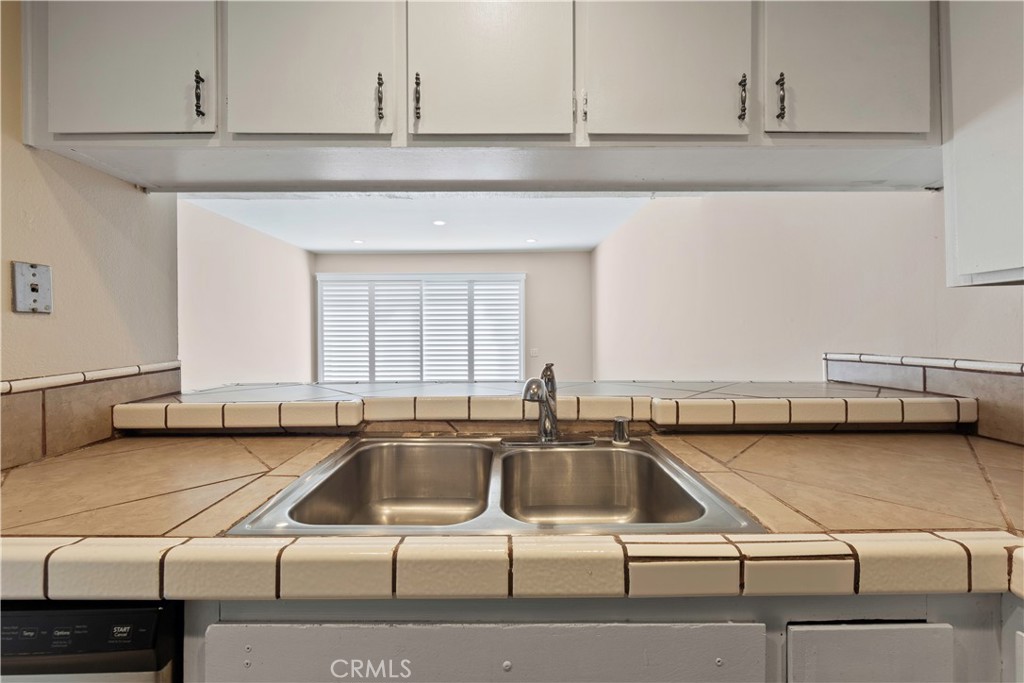 1381 South Walnut Street, Unit 2008 Anaheim, CA 92802 - Photo 13 of 40 a kitchen with a sink and cabinets