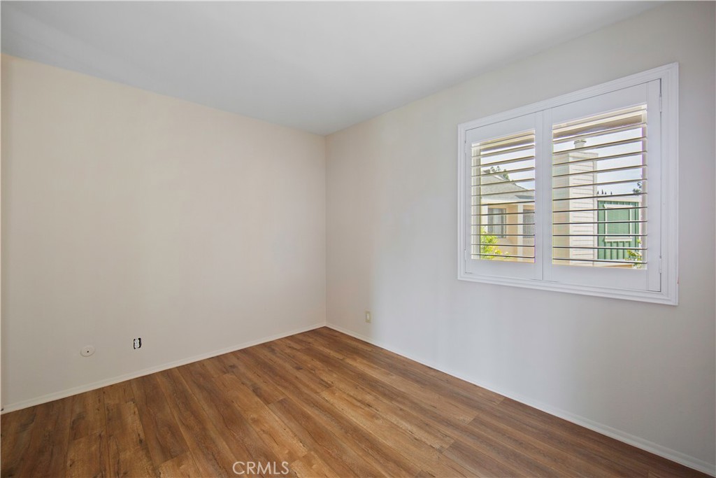 1381 South Walnut Street, Unit 2008 Anaheim, CA 92802 - Photo 18 of 40 a view of a room with wooden floor and a window
