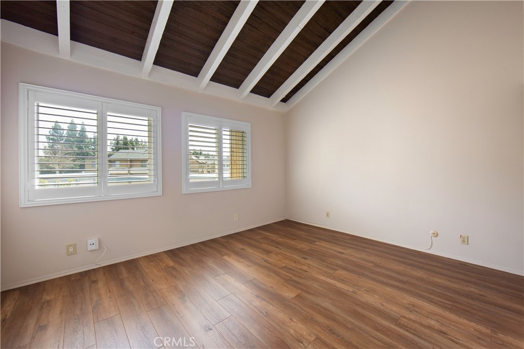 1381 South Walnut Street, Unit 2008 Anaheim, CA 92802 - Photo 20 of 40 an empty room with wooden floor and windows