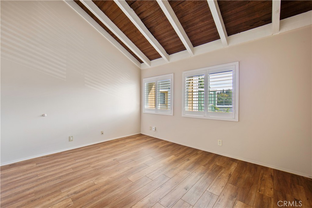 1381 South Walnut Street, Unit 2008 Anaheim, CA 92802 - Photo 25 of 40 an empty room with wooden floor and windows