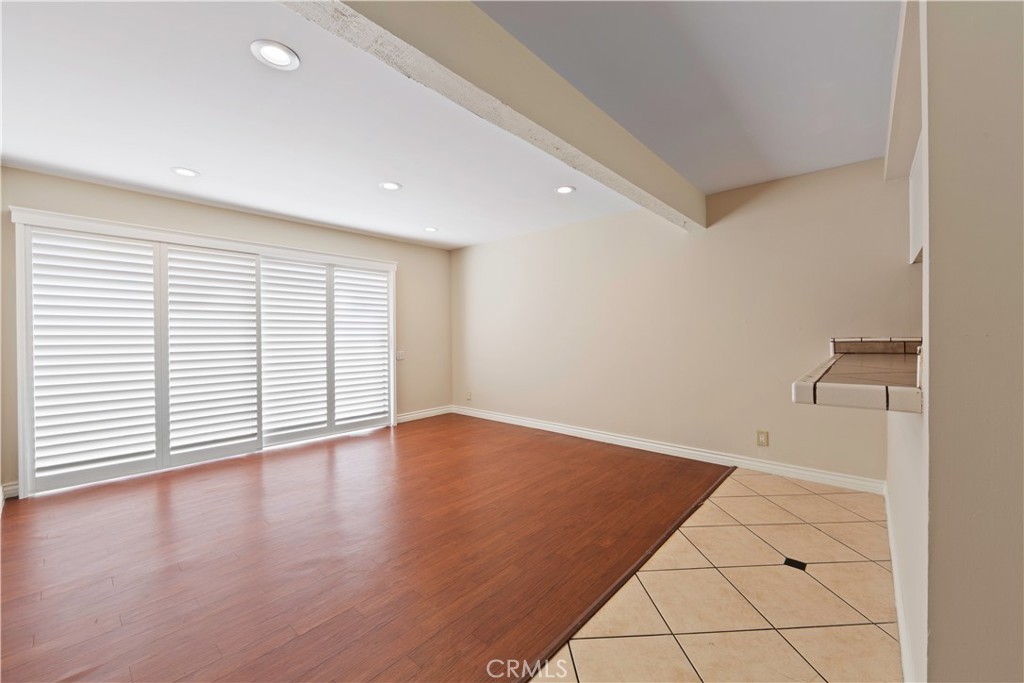1381 South Walnut Street, Unit 2008 Anaheim, CA 92802 - Photo 3 of 40 an empty room with wooden floor and windows