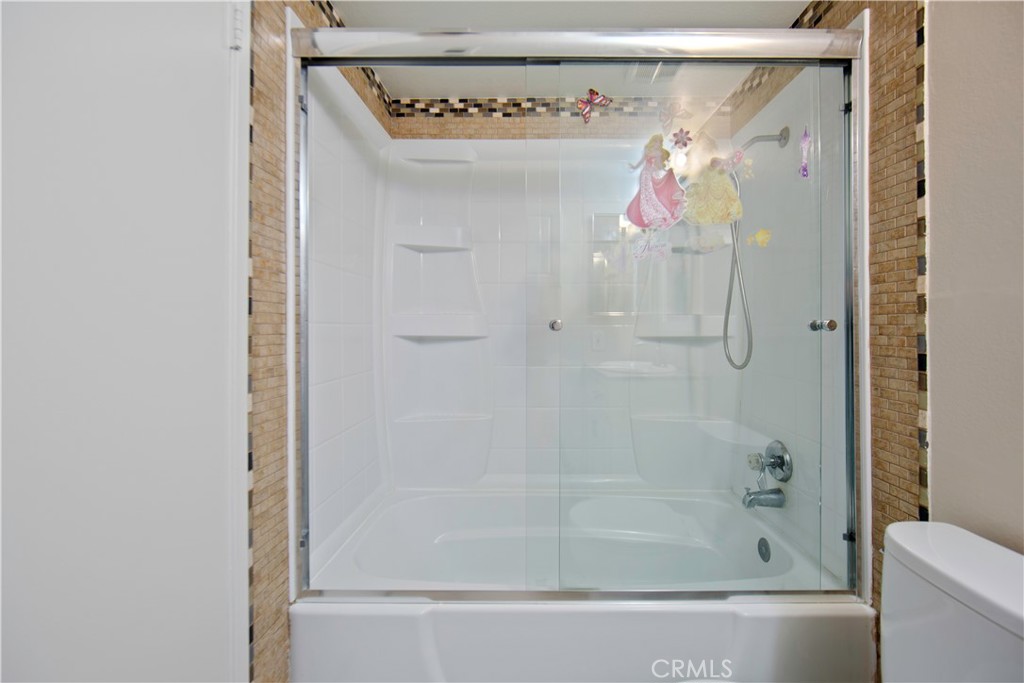 1381 South Walnut Street, Unit 2008 Anaheim, CA 92802 - Photo 31 of 40 a bathroom with a bathtub and a shower