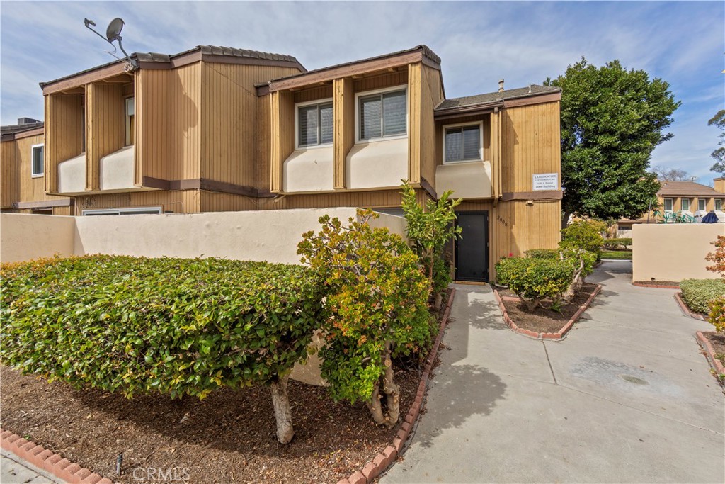 1381 South Walnut Street, Unit 2008 Anaheim, CA 92802 - Photo 34 of 40 a front view of a house with garden
