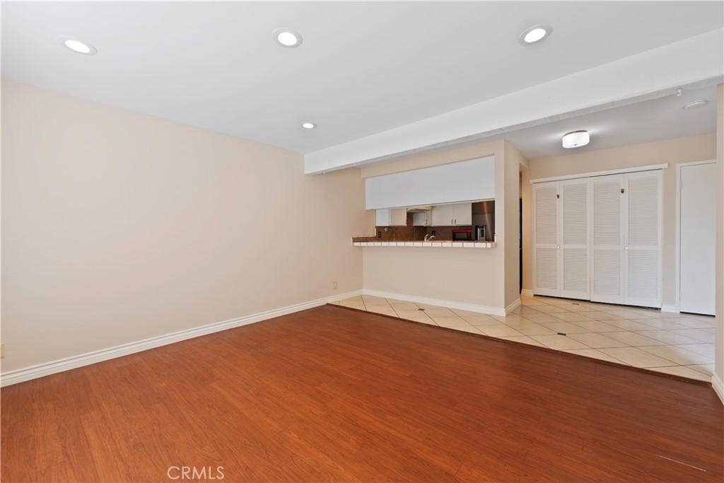 1381 South Walnut Street, Unit 2008 Anaheim, CA 92802 - Photo 4 of 40 a view of empty room with wooden floor