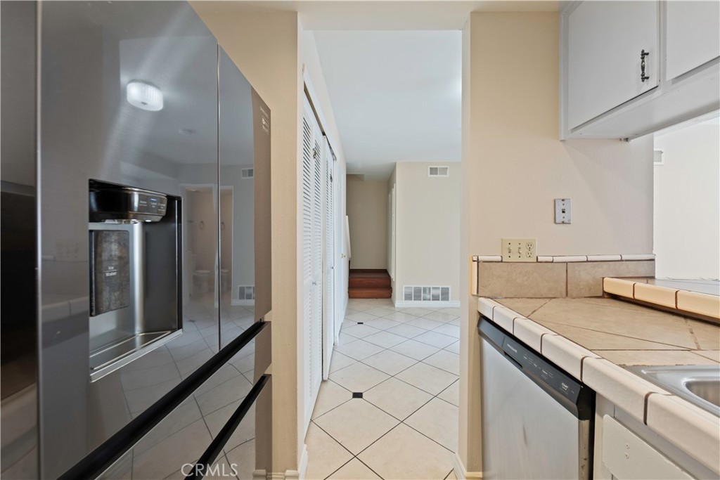 1381 South Walnut Street, Unit 2008 Anaheim, CA 92802 - Photo 10 of 40 a view of a kitchen cabinets a sink and dishwasher