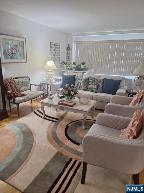 280 Prospect, Unit 9H Hackensack, NJ 07601 - Photo 11 of 38 a living room with furniture and a wooden floor