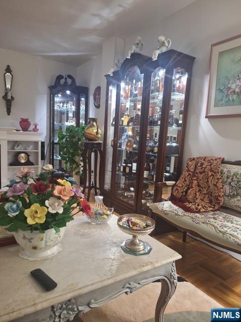 280 Prospect, Unit 9H Hackensack, NJ 07601 - Photo 15 of 38 a living room with furniture and chandelier