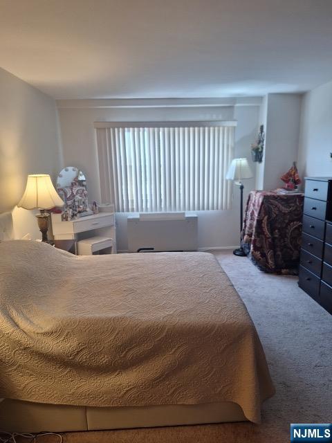 280 Prospect, Unit 9H Hackensack, NJ 07601 - Photo 22 of 38 a bedroom with a bed and a lamp