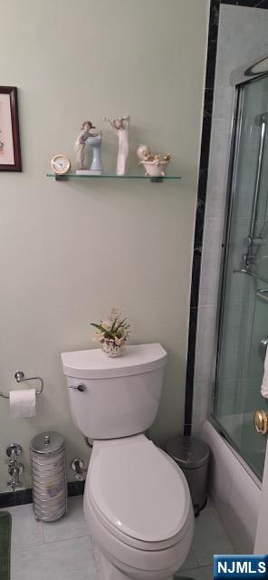 280 Prospect, Unit 9H Hackensack, NJ 07601 - Photo 28 of 38 a white toilet sitting next to a bathroom sink and a mirror