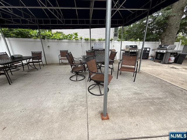 280 Prospect, Unit 9H Hackensack, NJ 07601 - Photo 35 of 38 a patio with a table and chairs