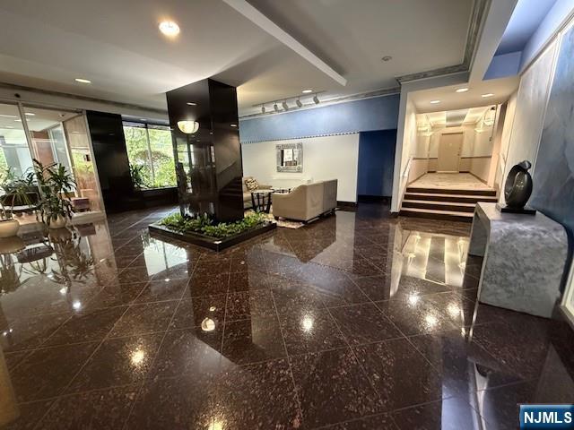 280 Prospect, Unit 9H Hackensack, NJ 07601 - Photo 4 of 38 a lobby with furniture and floor to ceiling window