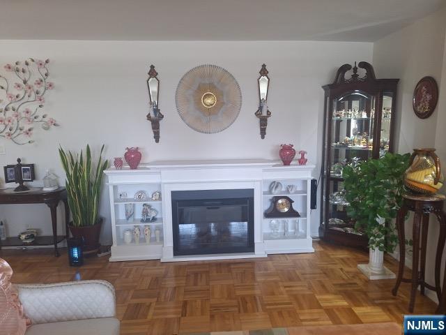 280 Prospect, Unit 9H Hackensack, NJ 07601 - Photo 6 of 38 a living room with furniture and a fireplace