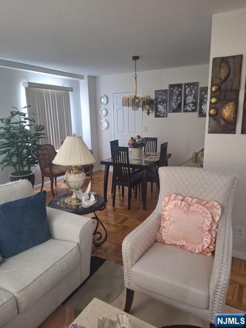 280 Prospect, Unit 9H Hackensack, NJ 07601 - Photo 7 of 38 a living room with furniture a rug and a window