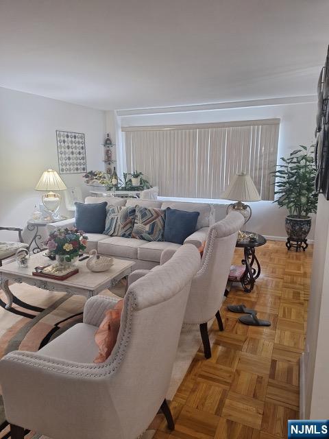 280 Prospect, Unit 9H Hackensack, NJ 07601 - Photo 9 of 38 a living room with furniture and a potted plant