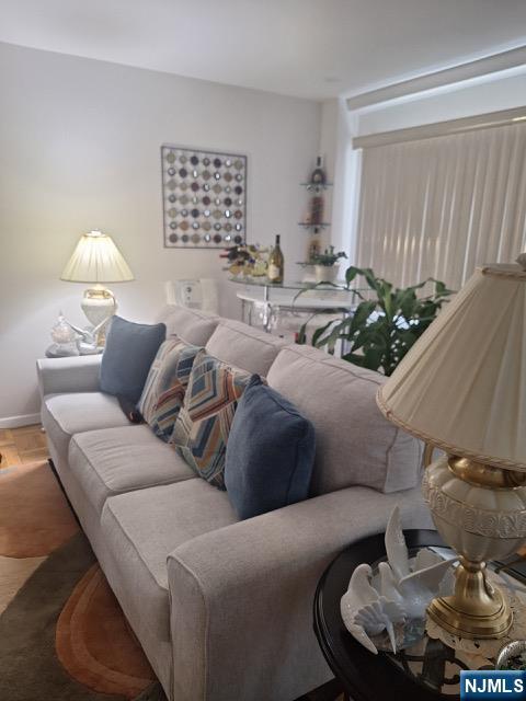 280 Prospect, Unit 9H Hackensack, NJ 07601 - Photo 10 of 38 a living room with furniture and a potted plant
