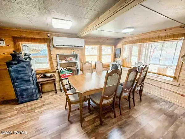 a dining room with furniture window wooden floor
