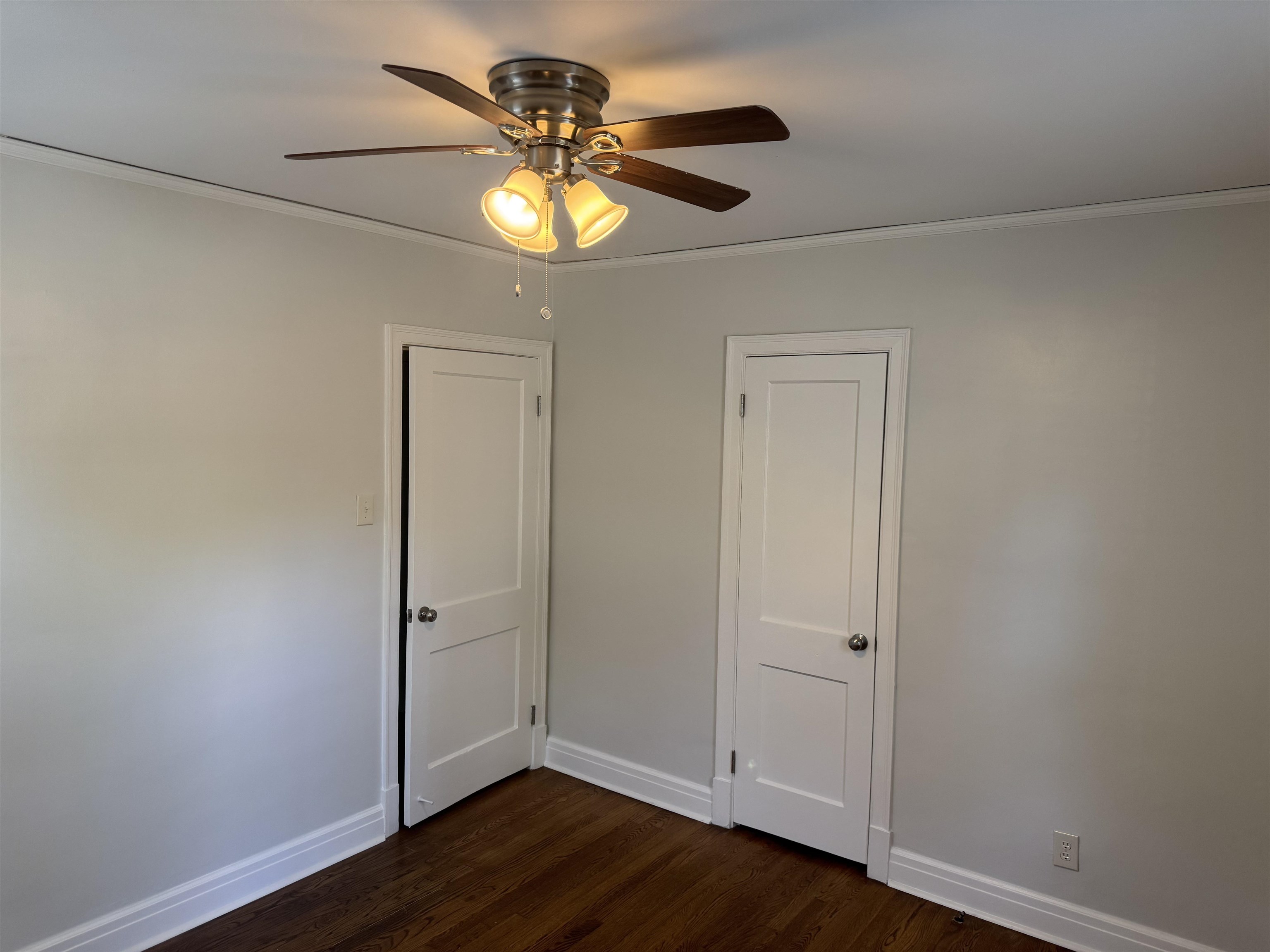 193 Alexander Street Memphis, TN 38111 - Photo 16 of 25 an empty room with wooden floor and chandelier