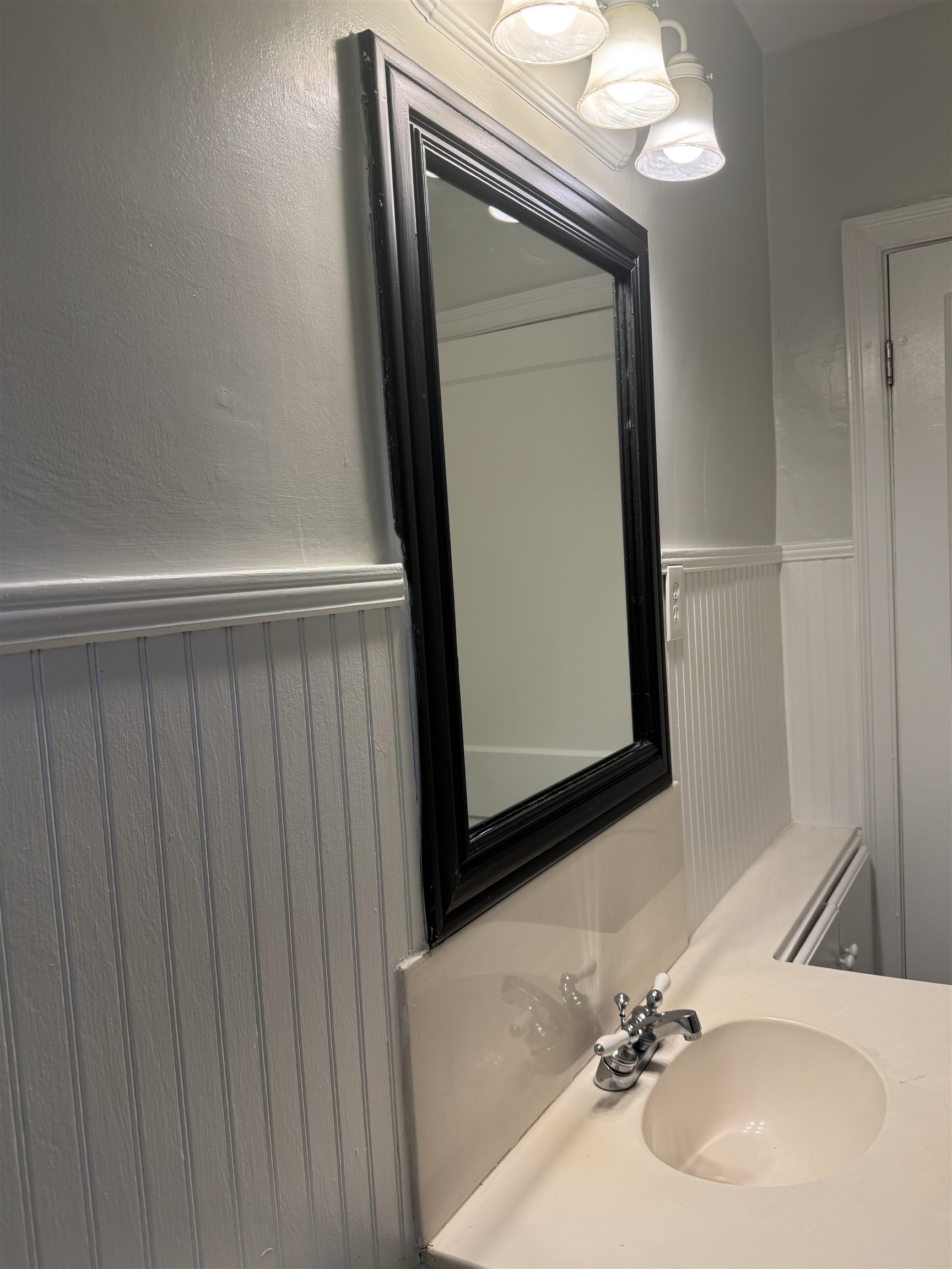 193 Alexander Street Memphis, TN 38111 - Photo 18 of 25 a bathroom with a sink a mirror and vanity
