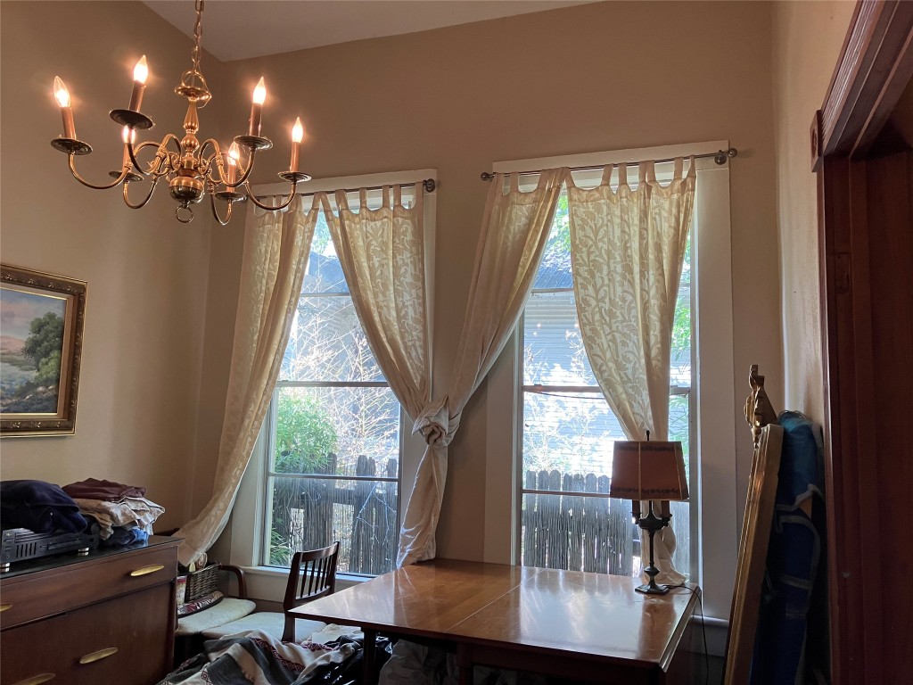 4010 Avenue B Austin, TX 78751 - Photo 10 of 17 a view of a dining room with furniture wooden floor and chandelier
