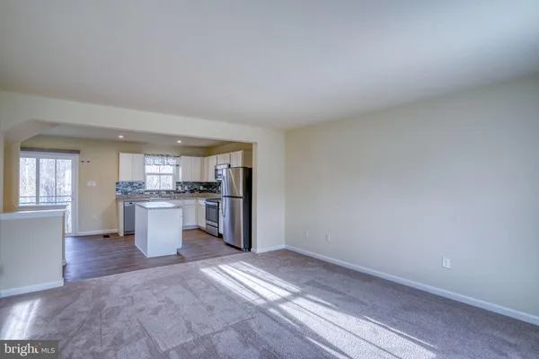 a view of kitchen with wooden floor