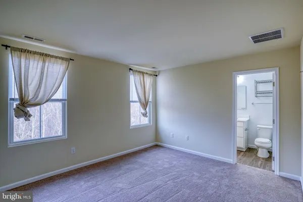 a big room with windows and a bathroom view