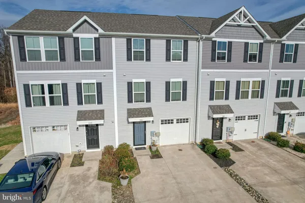 a front view of a house with yard