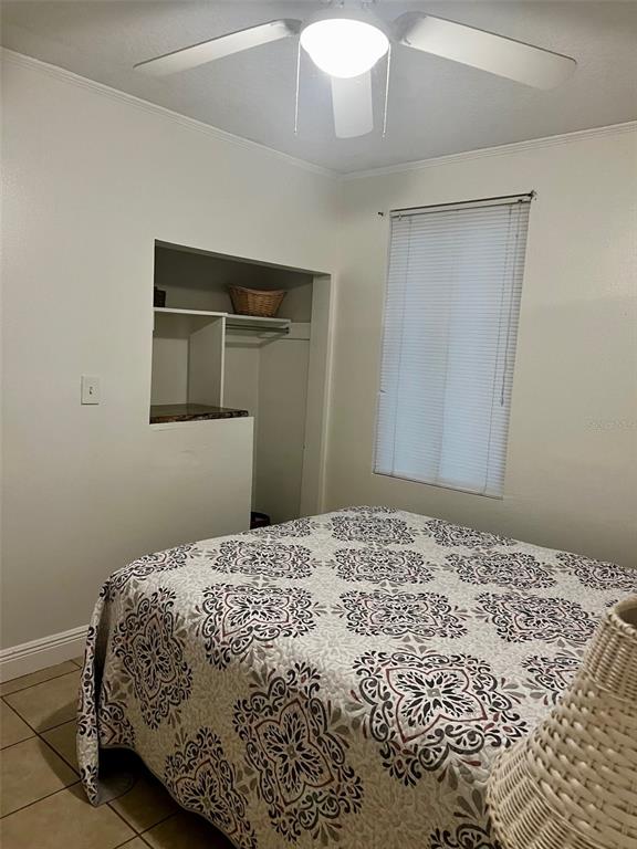 195 Mae Street, Unit A Eustis, FL 32726 - Photo 4 of 15 a bedroom with a bed and a window