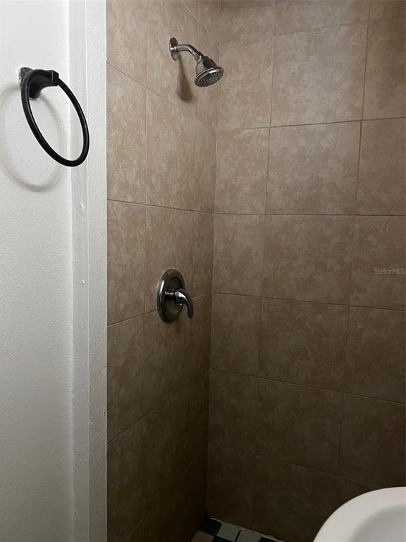195 Mae Street, Unit A Eustis, FL 32726 - Photo 7 of 15 a bathroom with a shower and toilet