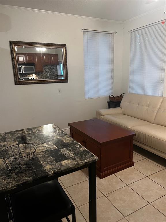 195 Mae Street, Unit A Eustis, FL 32726 - Photo 9 of 15 a living room with furniture and a table