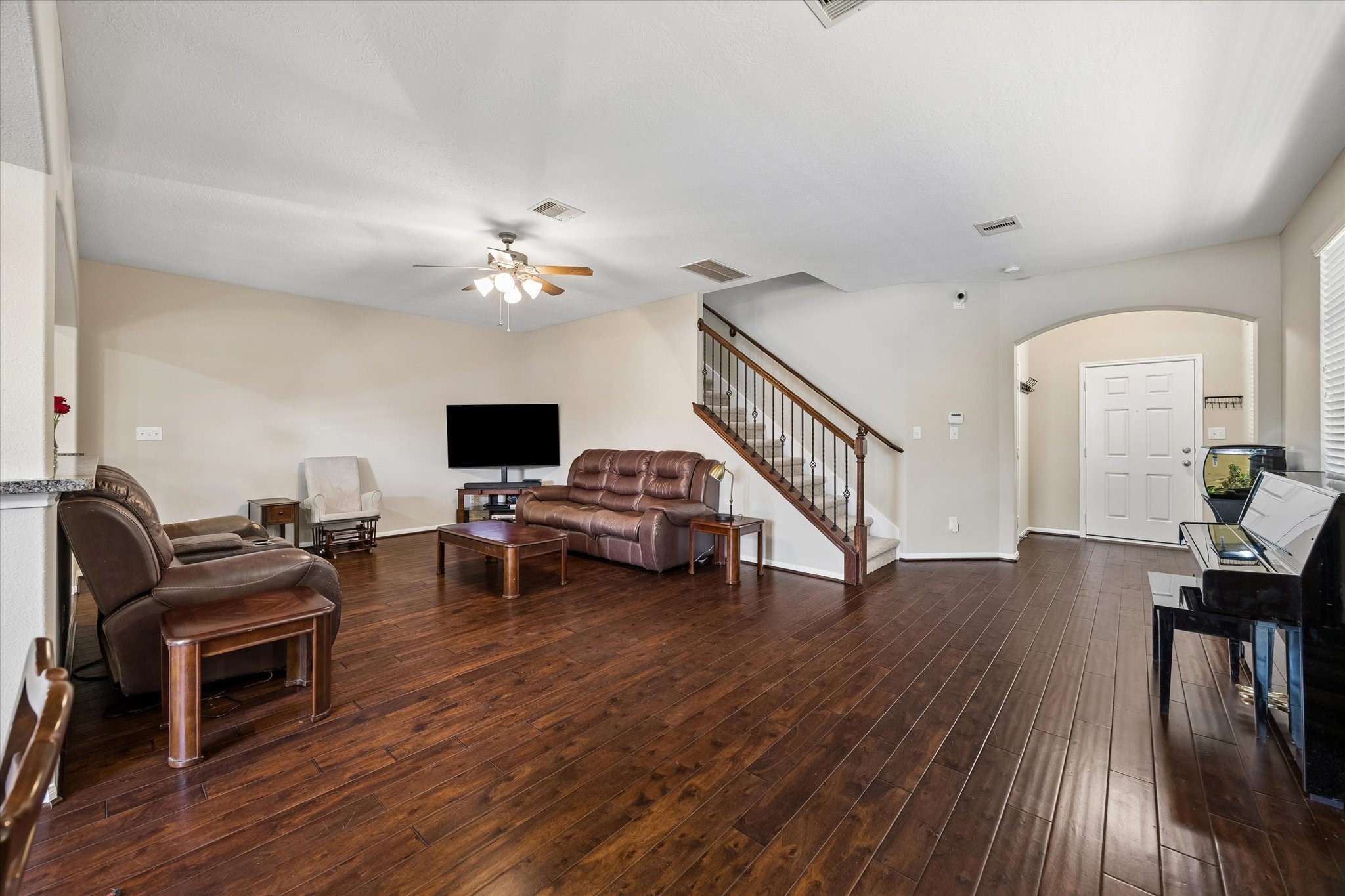 8433 Sunset Loch Drive Spring, TX 77379 - Photo 7 of 25 a living room with furniture and a flat screen tv
