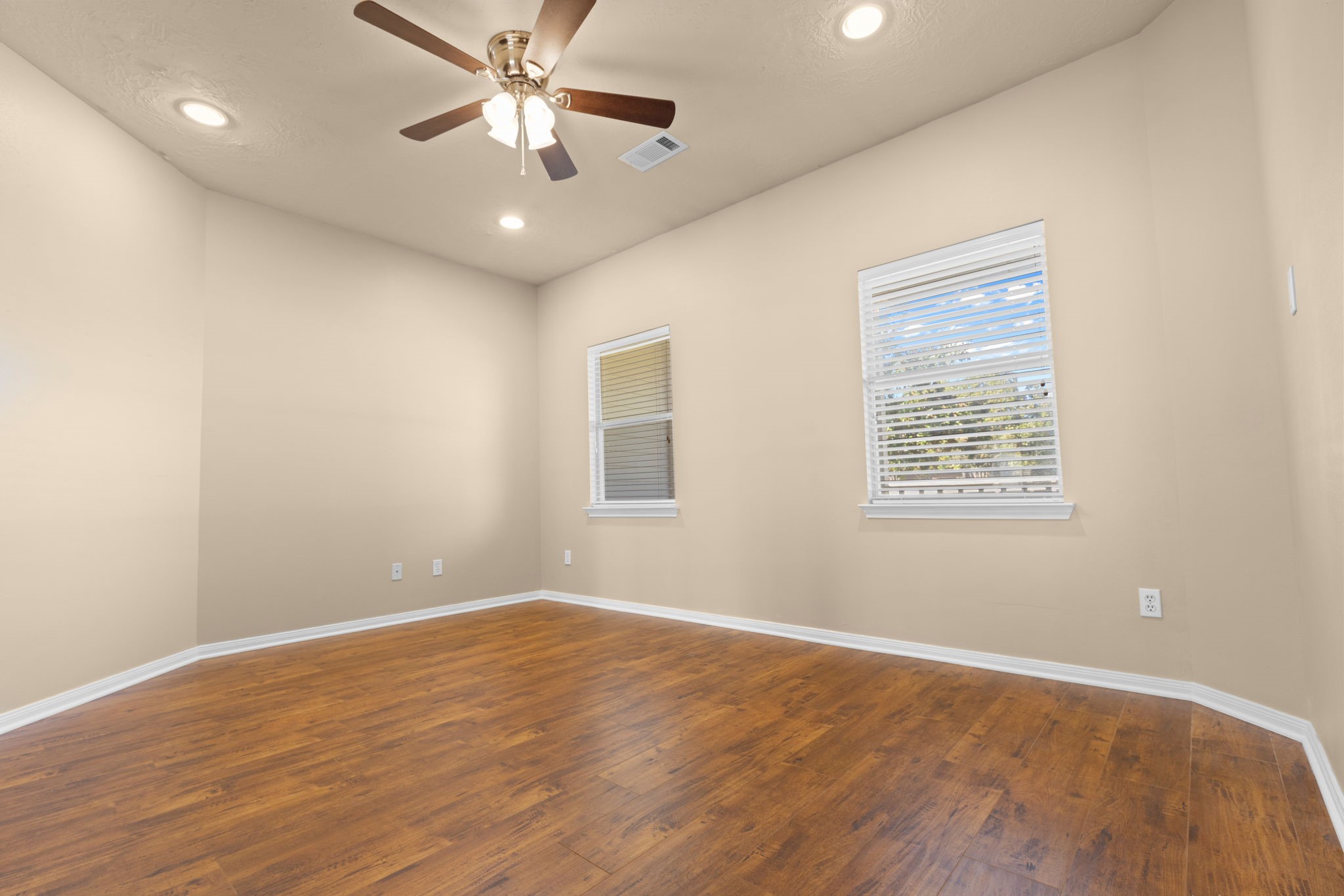 24236 Stuebner Airline Road Tomball, TX 77375 - Photo 13 of 39 wooden floor in an empty room with a window