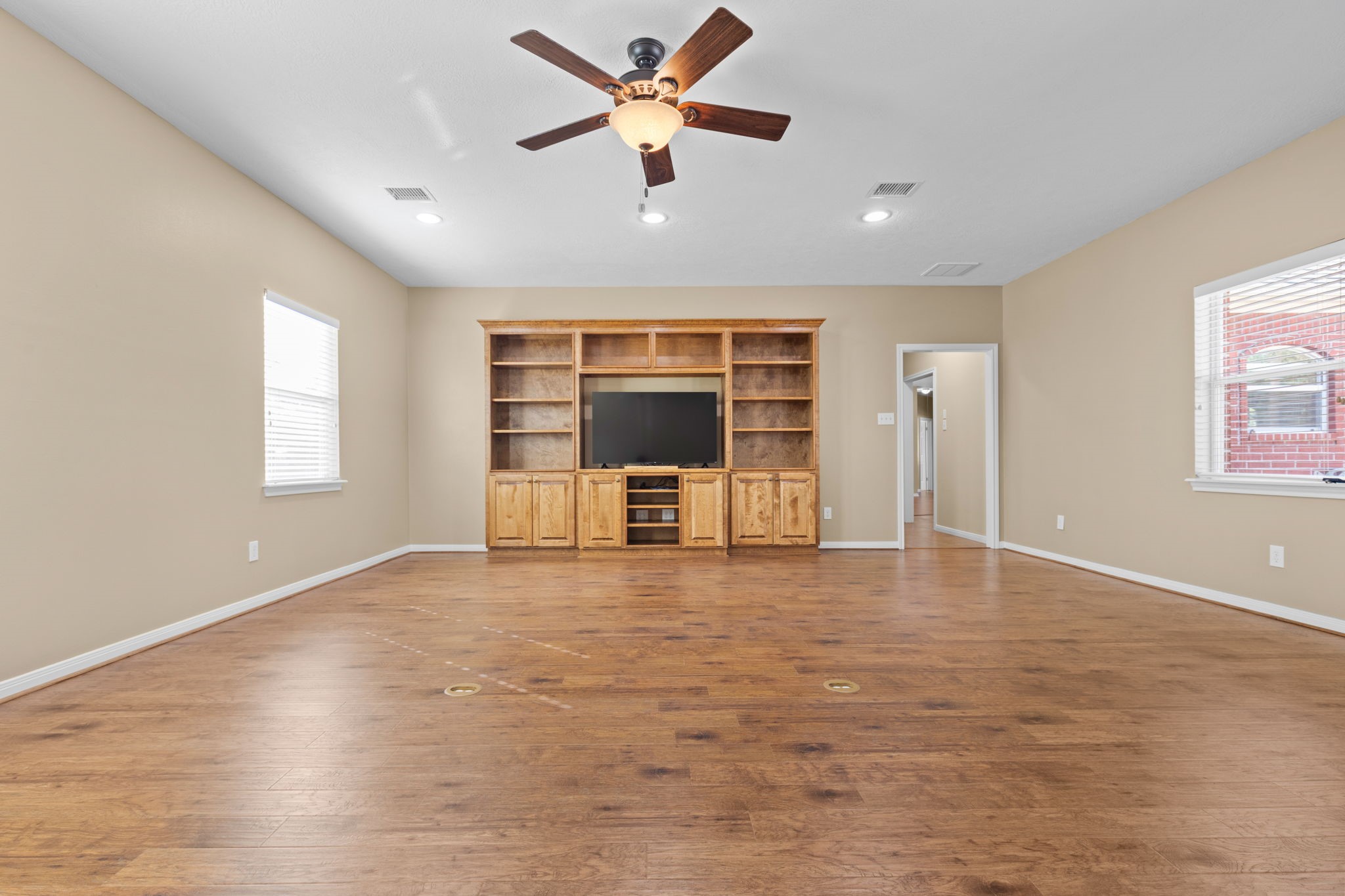 24236 Stuebner Airline Road Tomball, TX 77375 - Photo 14 of 39 a view of an empty room with a window and kitchen view