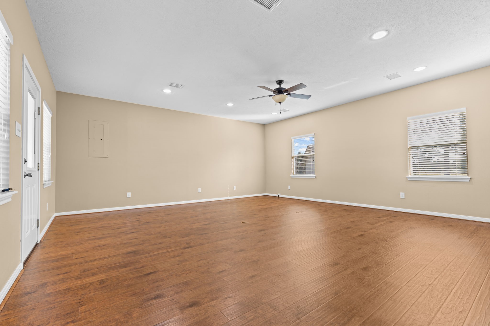 24236 Stuebner Airline Road Tomball, TX 77375 - Photo 15 of 39 wooden floor in an empty room with a window