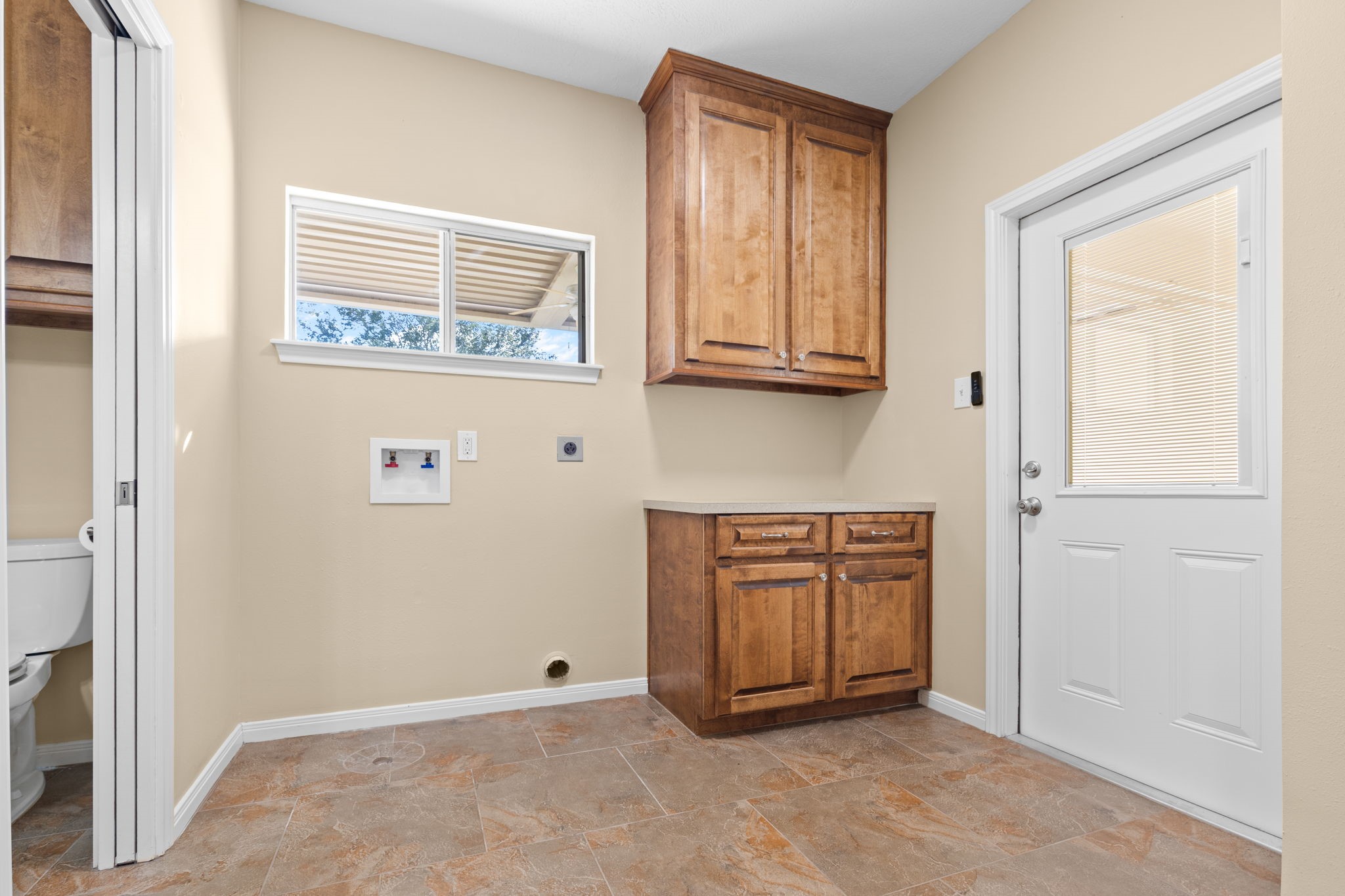 24236 Stuebner Airline Road Tomball, TX 77375 - Photo 16 of 39 a view of an empty room with wooden floor and a window
