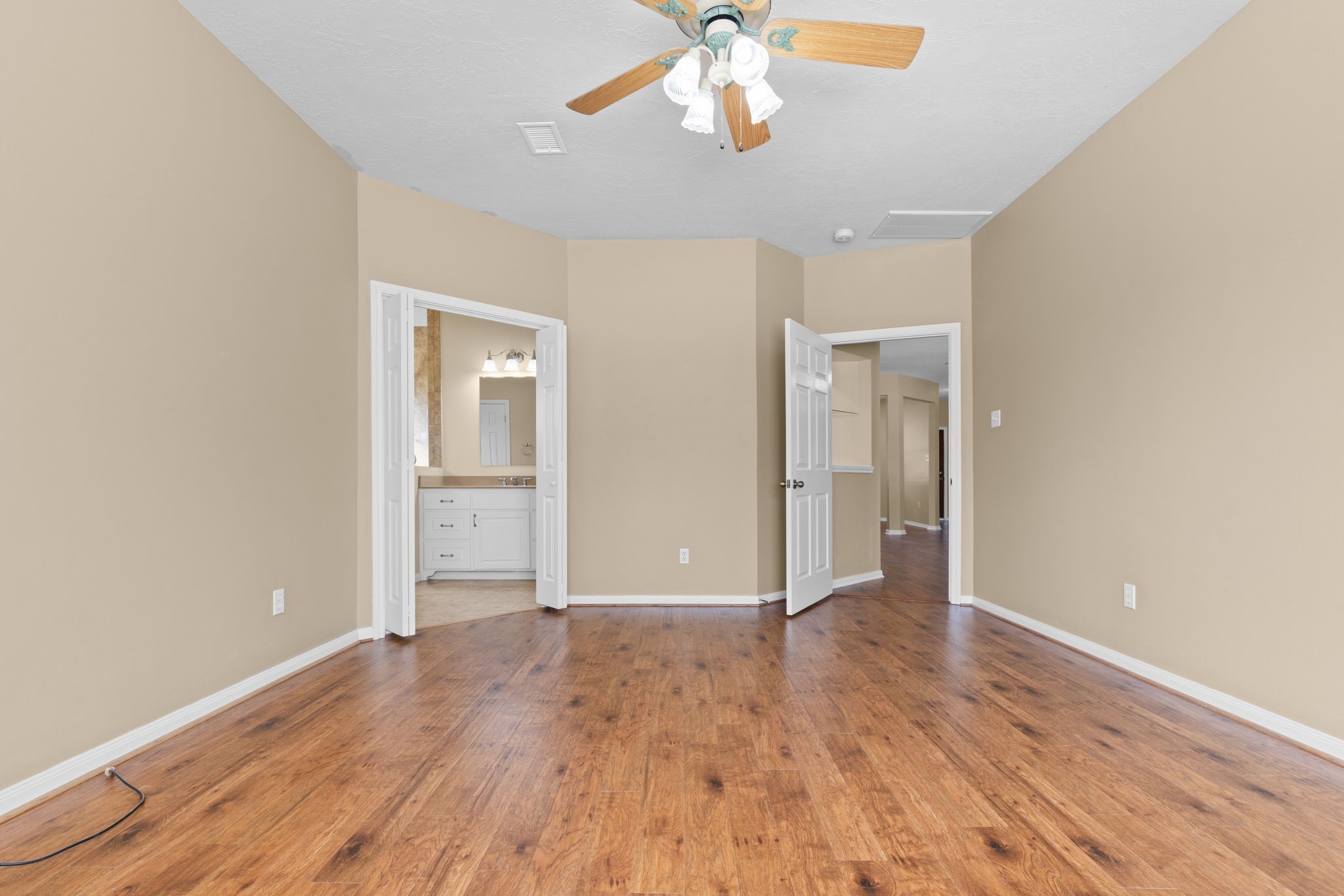 24236 Stuebner Airline Road Tomball, TX 77375 - Photo 20 of 39 a view of an empty room with wooden floor