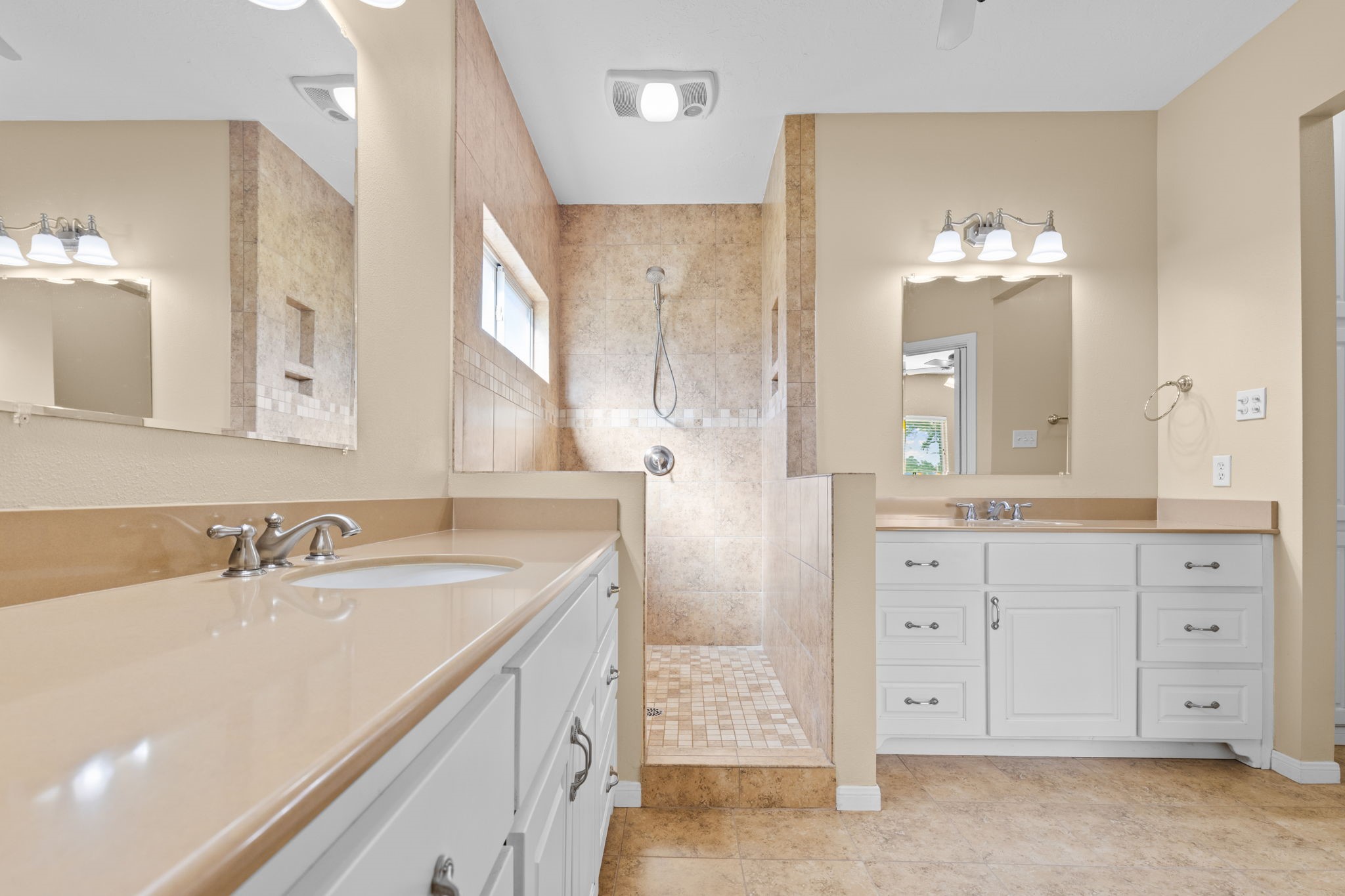 24236 Stuebner Airline Road Tomball, TX 77375 - Photo 22 of 39 a spacious bathroom with a double vanity sink mirror and double