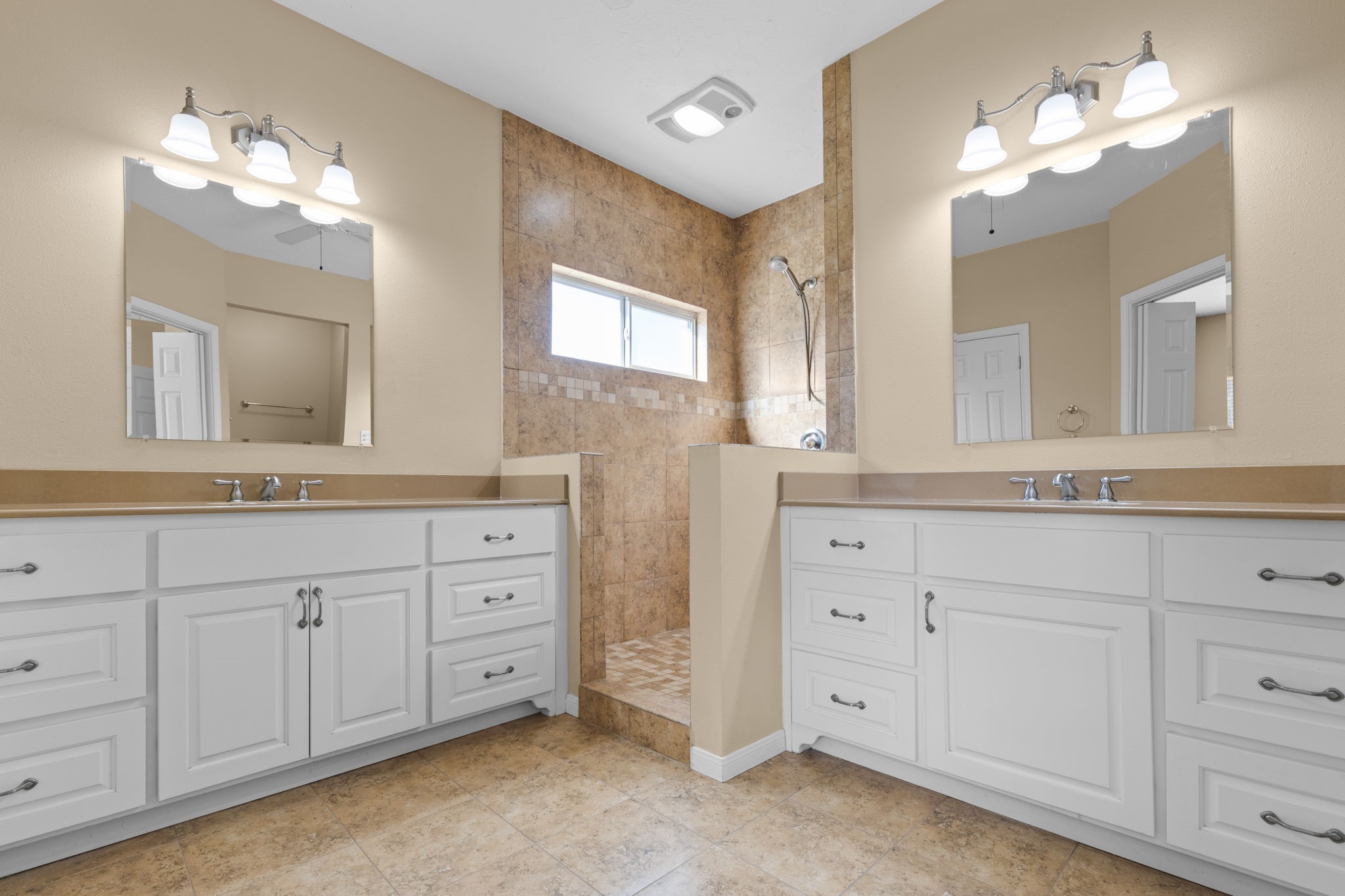 24236 Stuebner Airline Road Tomball, TX 77375 - Photo 23 of 39 a bathroom with a sink vanity and mirror