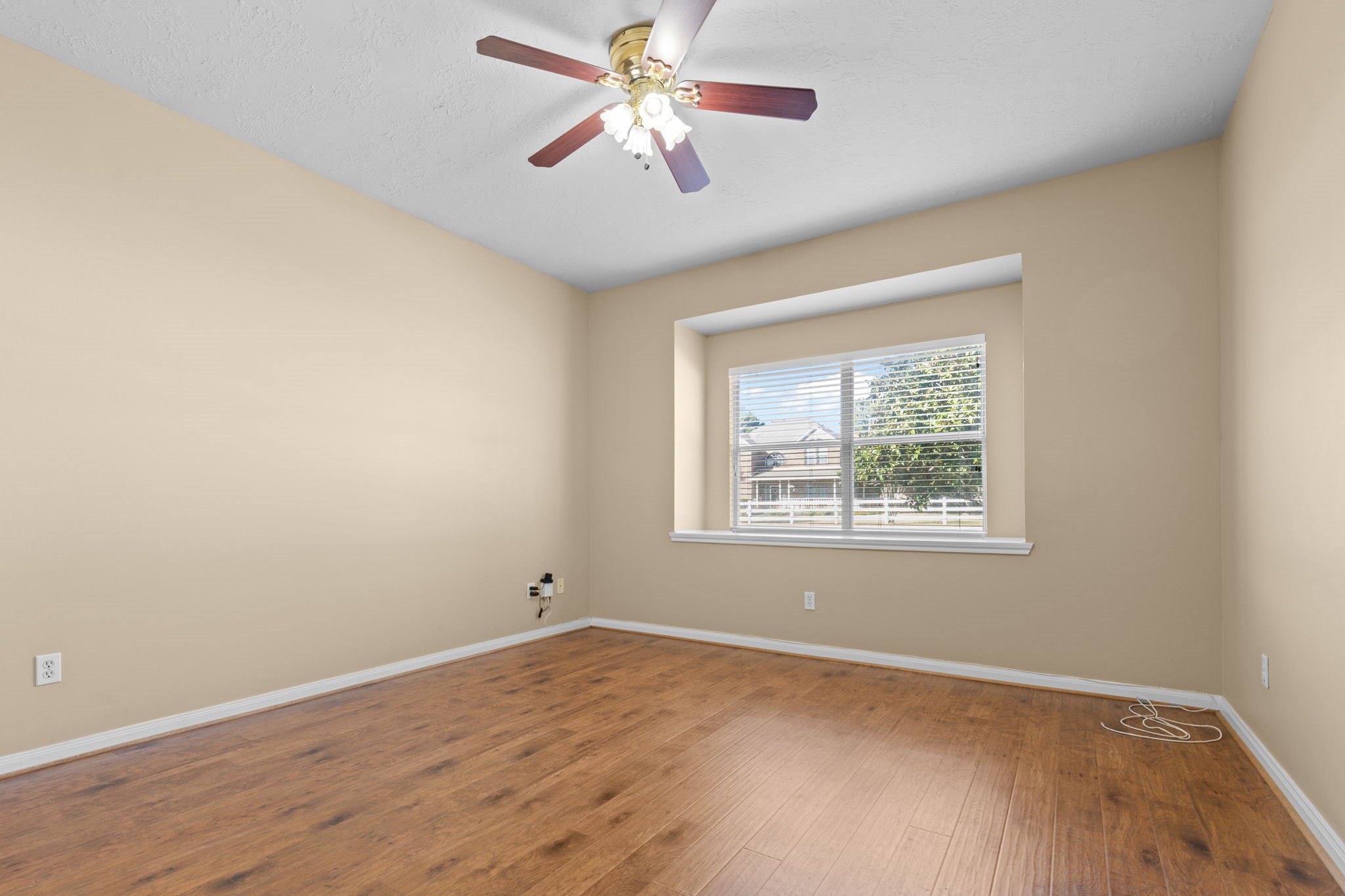 24236 Stuebner Airline Road Tomball, TX 77375 - Photo 26 of 39 an empty room with a window and a fan